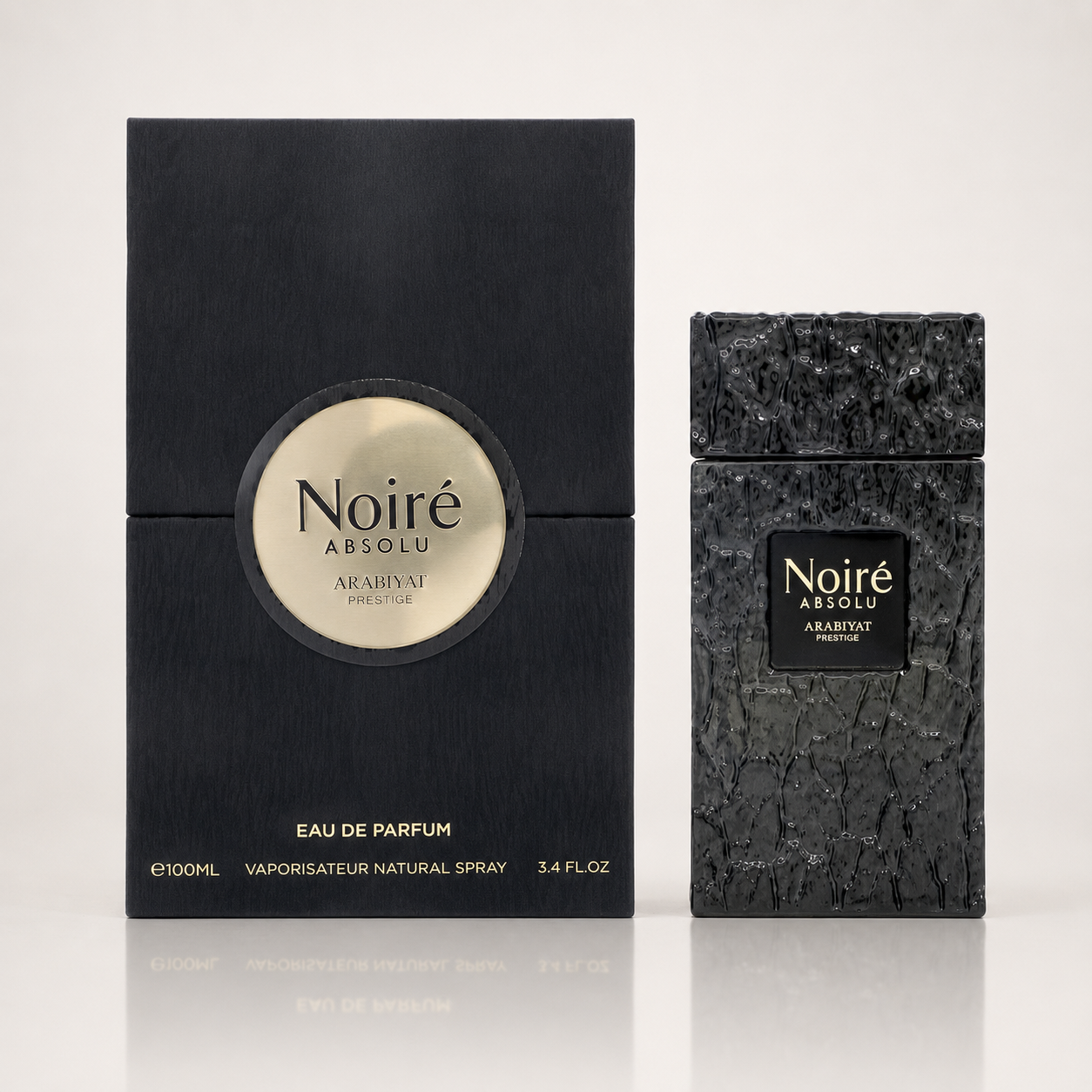 Noiré Absolu by Arabiyat Prestige perfume shown with its black rectangular box and the textured black spray bottle on a light gray background.