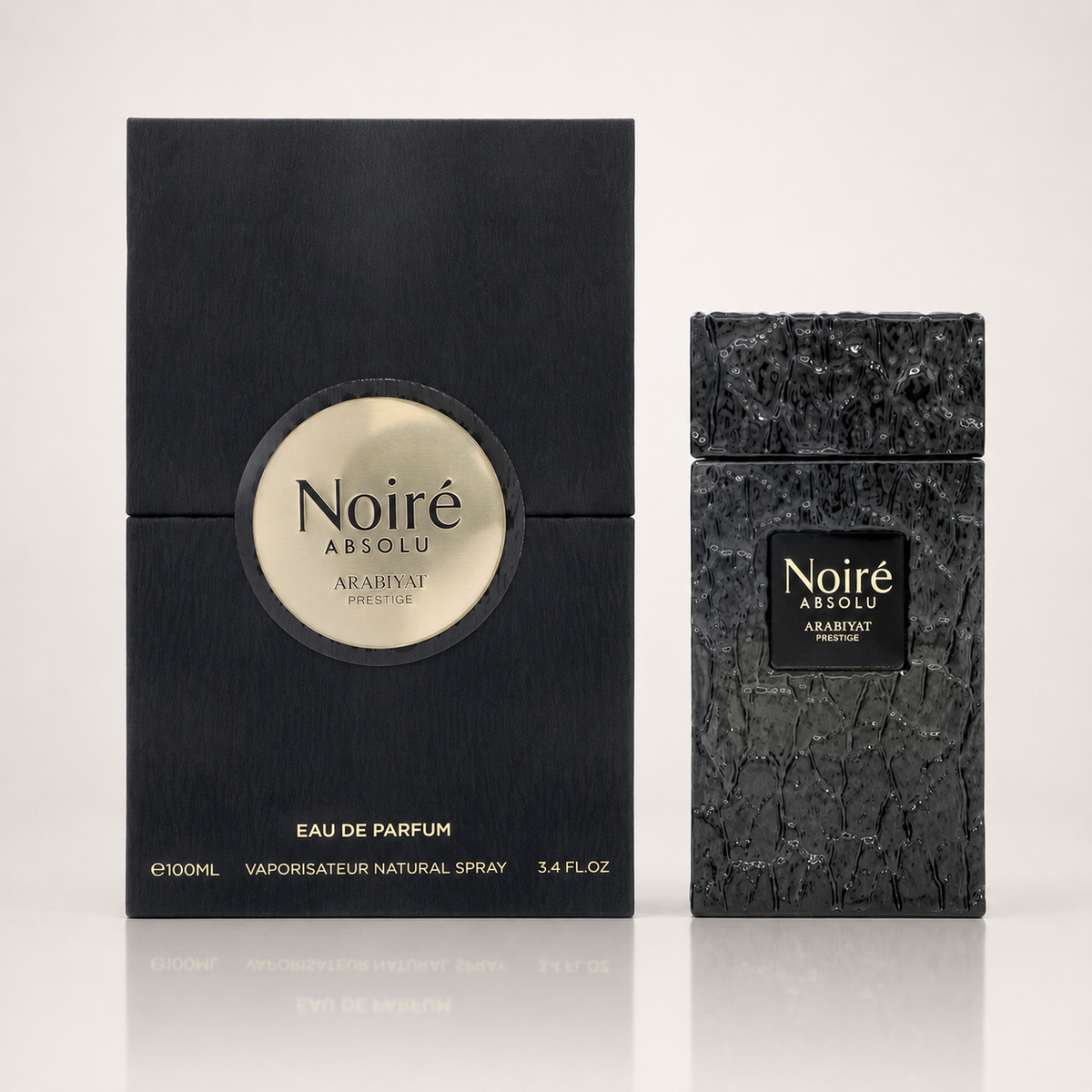Noiré Absolu by Arabiyat Prestige perfume shown with its black rectangular box and the textured black spray bottle on a light gray background.